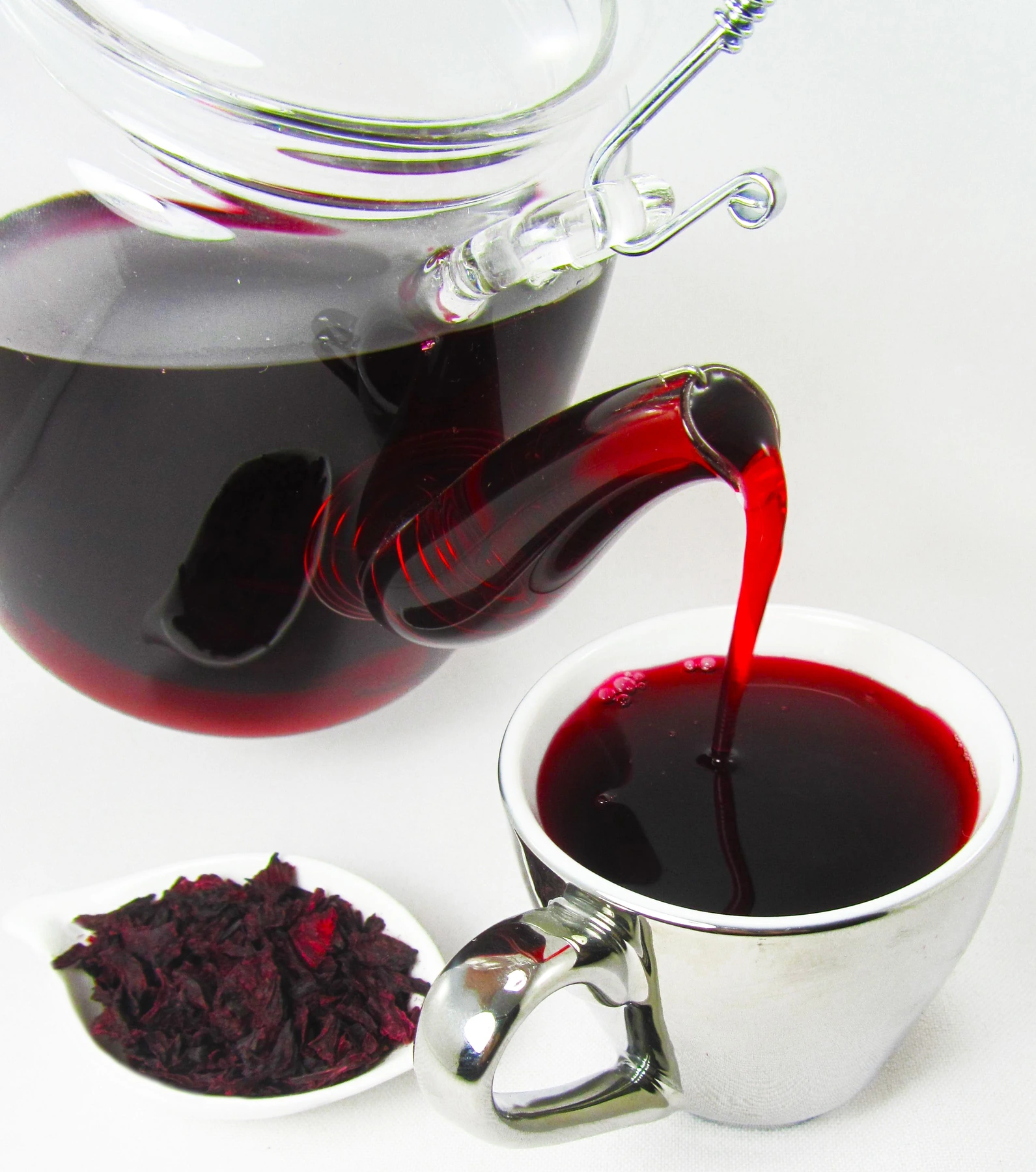 Hibiscus tea being poured into a cup