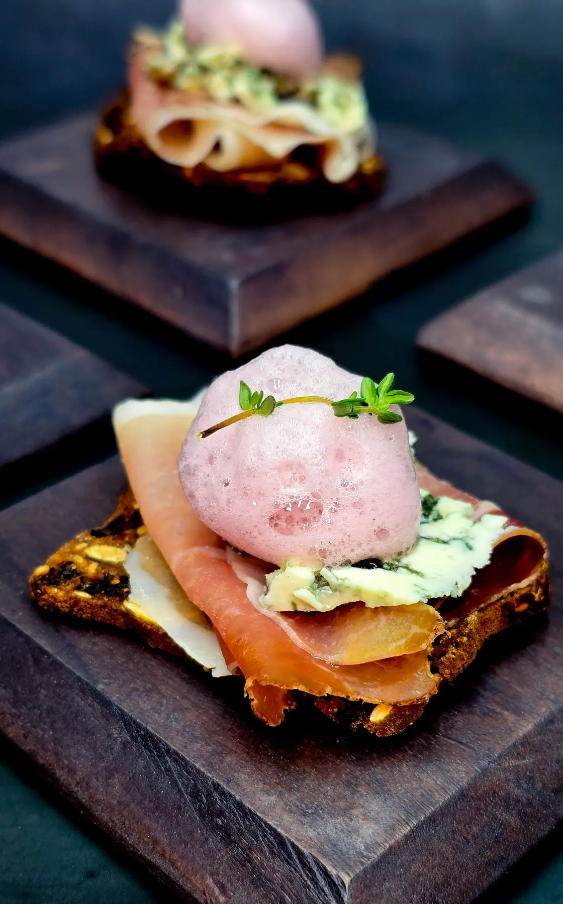 A savoury canapé with hibiscus syrup foam